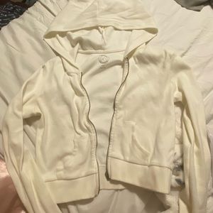 urban outfitters cropped white zip up. size M.
